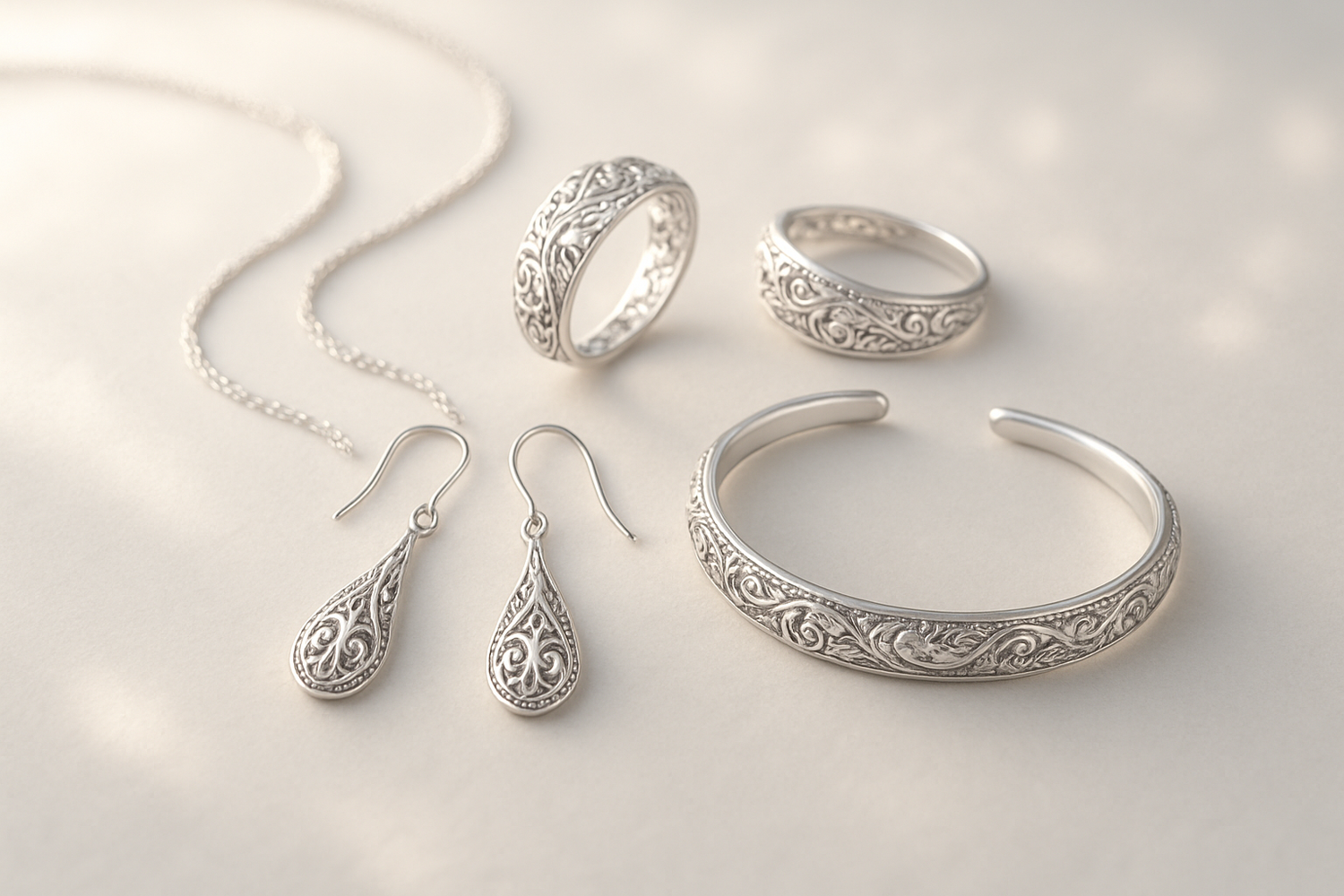 Silver jewellery is a carfted art. Create a beautiful subtle jewellery image that i an use in background. the jewellery should look like real jewellery